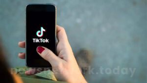 User scrolling TikTok on smartphone in the U.S.